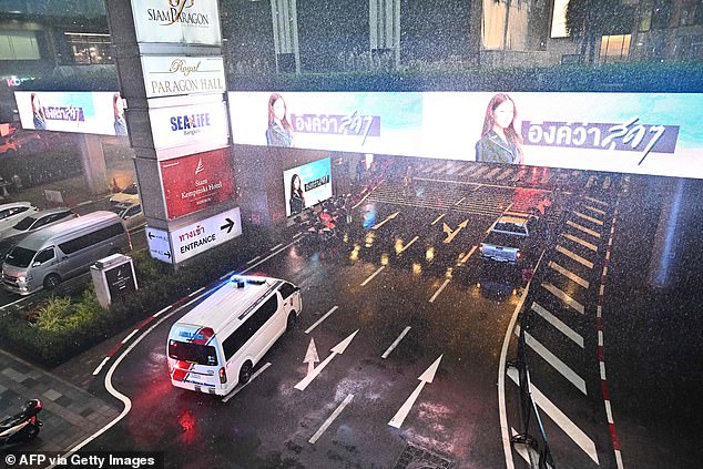 An ambulance arrives at Siam Paragon shopping center in central Bangkok on October 3, 2023.  Hundreds of people have fled a shooting incident in the shopping center in central Bangkok