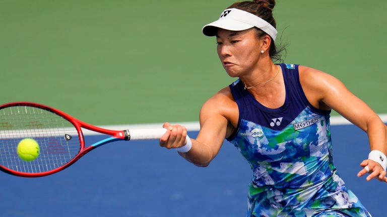 Yuriko Lily Miyazaki, of Great Britain, returns a shot to Belinda Bencic, of Switzerland, during the second round of the US Open tennis championships, Wednesday, August 30, 2023, in New York.  (AP Photo/Manu Fernandez)