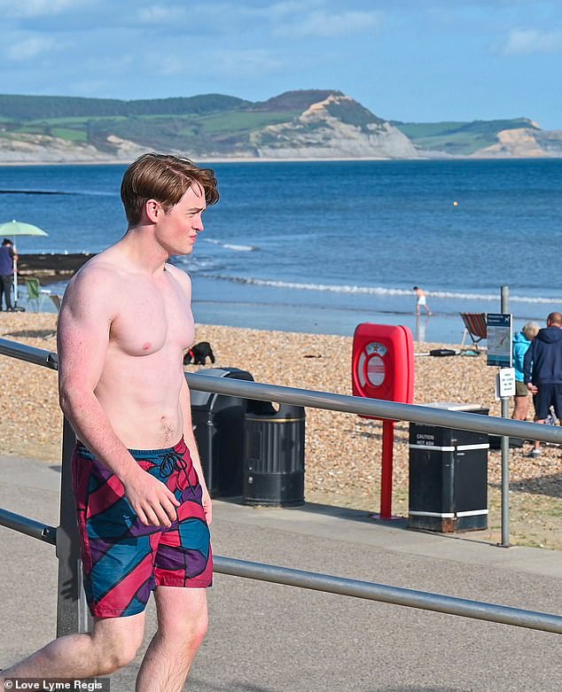 On the beach!  Heartstopper star Kit Connor, 19, (Nick Nelson), showed off his toned torso on Tuesday when he was spotted filming scenes for series 3 of the hit Netflix show