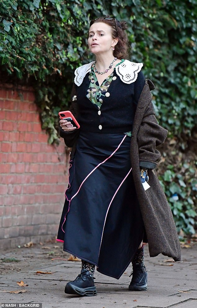 What is?  Helena Bonham Carter looked unimpressed as she pouted through London's Primrose Hill in a dark royal outfit