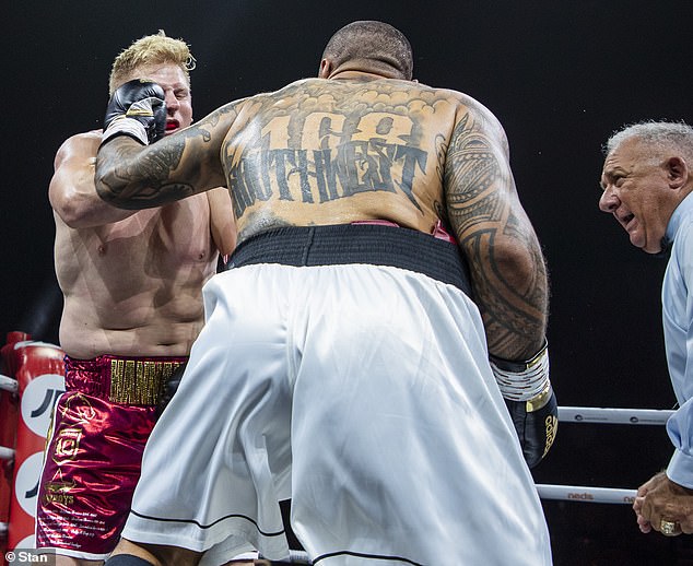 Ben Hannant (left) took a huge and unnecessary punishment from Junior Paulo (centre) after the referee failed to stop the fight when he was injured so badly he could barely stand.