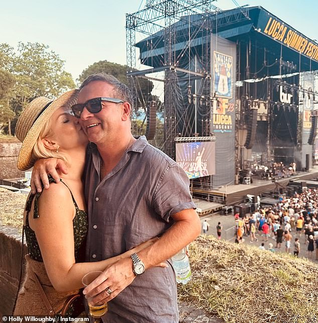 Couple: Holly kissed her husband Dan Baldwin, 49, on the cheek as she wished him a happy birthday in a loved-up post on Wednesday