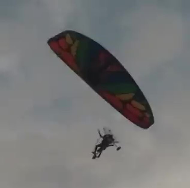 Hamas fighters bypassed Israel's border with the Gaza Strip by paragliding in, according to the Israeli military (pictured: Alleged paraglider crossing into Israel.