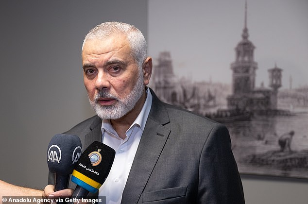 Ismail Haniyeh, pictured, was seen with other Hamas officials rejoicing in the safety of Qatar