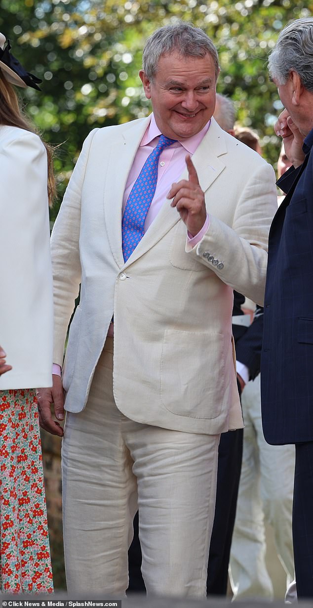 Speculation grew after Bonneville attended Michelle Dockery and Jasper Waller-Bridge's wedding ceremony last week without his ring.  Pictured: Hugh at the wedding on September 24