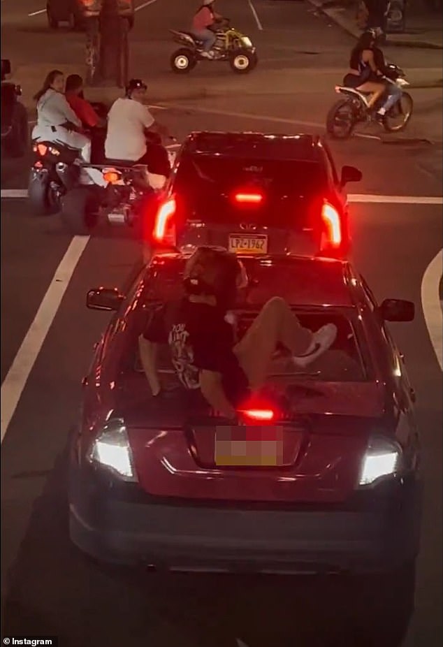 A Philadelphia dirt bike rider callously smashed the rear window of a car driven by a young mother who showed complete disregard for her children in the back