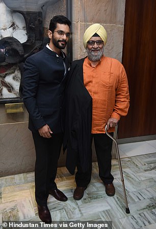 The Indian cricket legend, right, is pictured next to his son and actor Angad Bedi, left