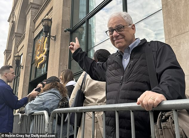 Michael Zorek, 63, stands in line outside the new Wegmans on Astor Place ahead of its opening Wednesday morning.  He said he has been waiting for more than a decade for a Wegmans to come to his home community