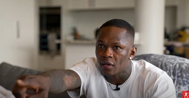 Israel Adesanya watched from his couch as he supported his friend Alexander Volkanovski