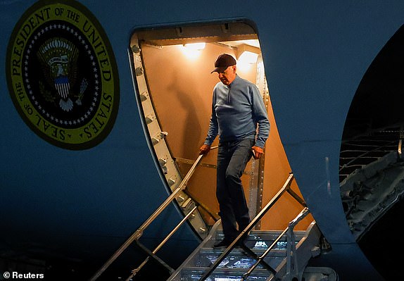 US President Joe Biden steps out at Joint Base Andrews, following his visit to Israel, amid the ongoing conflict between Israel and Hamas, in Maryland, US, October 19, 2023. REUTERS/Evelyn Hockstein