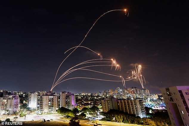 Israel's Iron Dome anti-missile system intercepts rockets fired from the Gaza Strip as seen from the city of Ashkelon, Israel on October 8, 2023. The preliminary death toll from the attack in Israel has reached 900