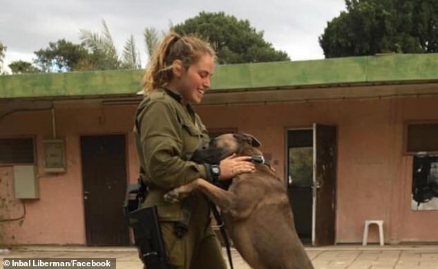 Inbar Lieberman, 25, who is the security coordinator of Kibbutz Nir Am, located a stone's throw from the Gaza Strip, leads a group of residents to kill more than two dozen advancing terrorists