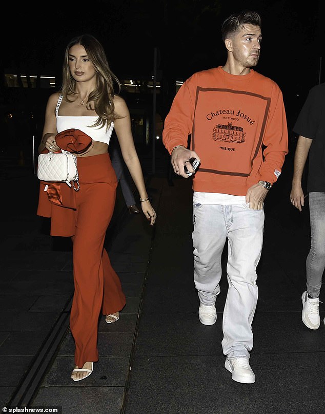 £100m man: It was a yellow card for Jack Grealish after he received another parking fine while on a date with girlfriend Sasha Attwood in Manchester on Thursday evening