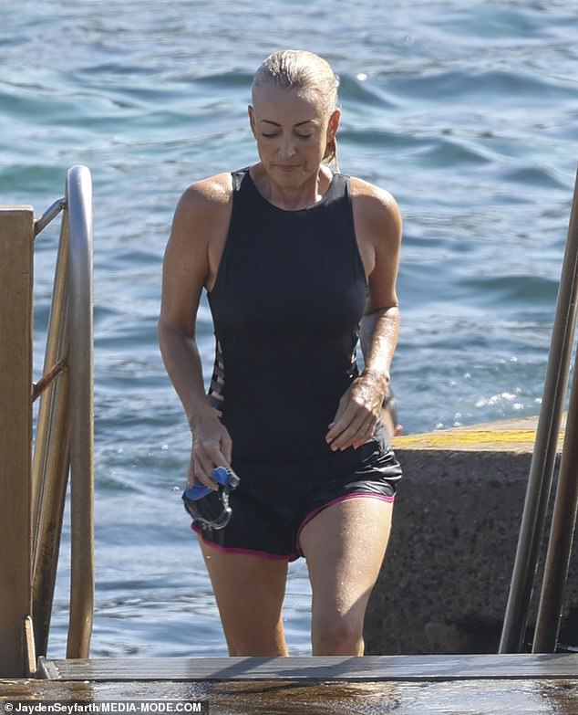 Jackie looked every bit a Bond girl as she emerged from the water