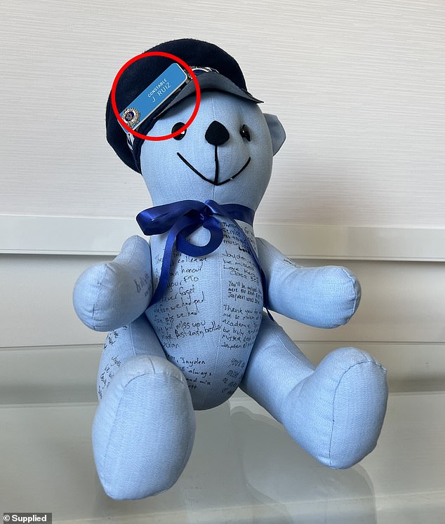 Mr. Ruiz's colleagues signed a bear made from police shirts, with Mr. Ruiz's name tag on the hat (photo)