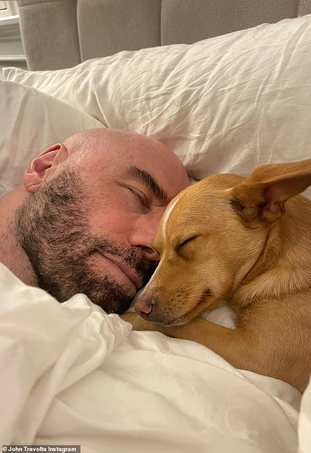 Sweet: John Travolta, 69, shared an adorable photo on his Instagram Story showing him sleeping next to his son's dog Peanut on the same pillow