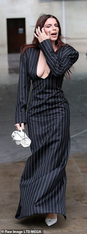 Style: She added a matching striped skirt and boosted her height with white heels