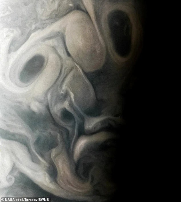 It captures Jupiter's moody clouds, forming a rather unusual pattern that gives the impression of distorted eyes, nose and mouth