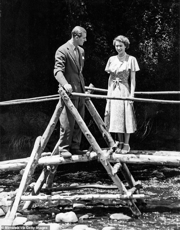 Princess Elizabeth and the Duke of Edinburgh on a bridge in the grounds of Sagana Lodge, their wedding gift from the people of Kenya on February 5, 1952. The next day news would arrive that her father, King George VI, had died.  Elizabeth was queen