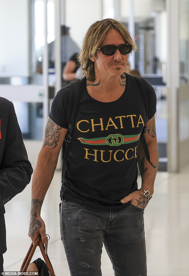 Keith, 55, was dressed in a T-shirt with the label "CHATTA HUCCI"- as a tribute to the country song from 1992 "Chattahoochee," by Alan Jackson, with the name misspelled and printed in the style of the Gucci logo