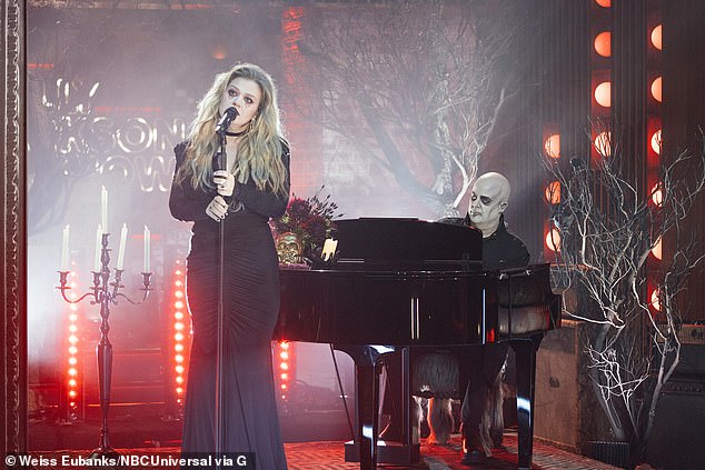 Scary: Kelly Clarkson dressed up for Halloween for her Tuesday talk show.  The 41-year-old crooner looked like Morticia in all black with some blood here and there, like under her eyes