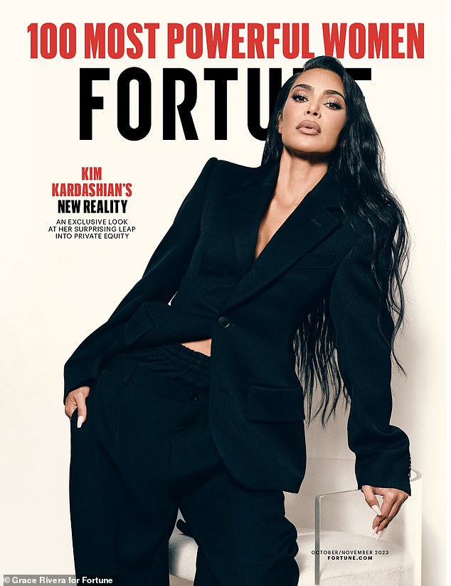 Power pose: Kim Kardashian graced the cover of Fortune's October/November issue released on Wednesday.  The 42-year-old reality TV personality, named one of the magazine's 100 most powerful women, showed she meant business by modeling an oversized black blazer and matching pants.