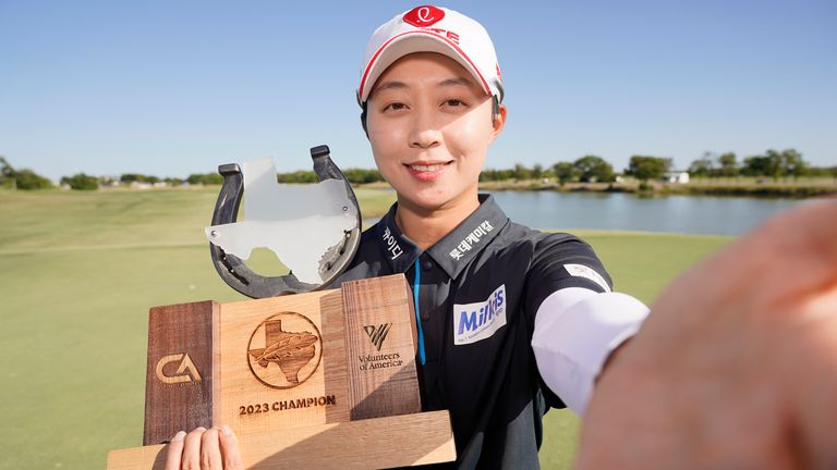 Hyo Joo Kim celebrates with her trophy after winning the Ascendant LPGA to benefit Volunteers of America