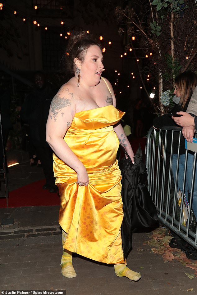 Comfort: Lena Dunham, 37, quickly swapped heels for stockings after Glamor's Women of the Year Awards on Tuesday night