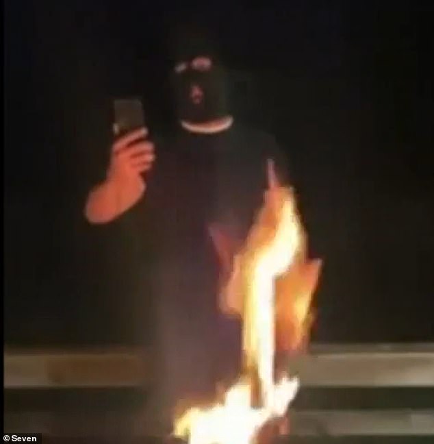 Australian Federal Police are investigating a disturbing video of a balaclava-clad neo-Nazi threatening Lidia Thorpe before burning an Aboriginal flag