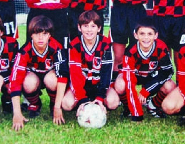 Messi (center, playing for the team as a youngster) plans to retire from Newell's Old Boys in Rosario, Argentina - the first professional club he represented