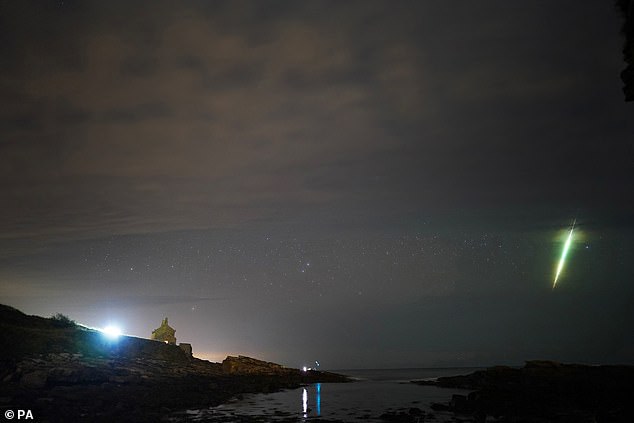 What you can see: The rate of meteors that can be seen depends on which part of the comet's path intersects Earth's orbit in any given year, according to the Royal Observatory Greenwich.  Pictured are Draconids above the Howick Rocks in Northumberland in 2021