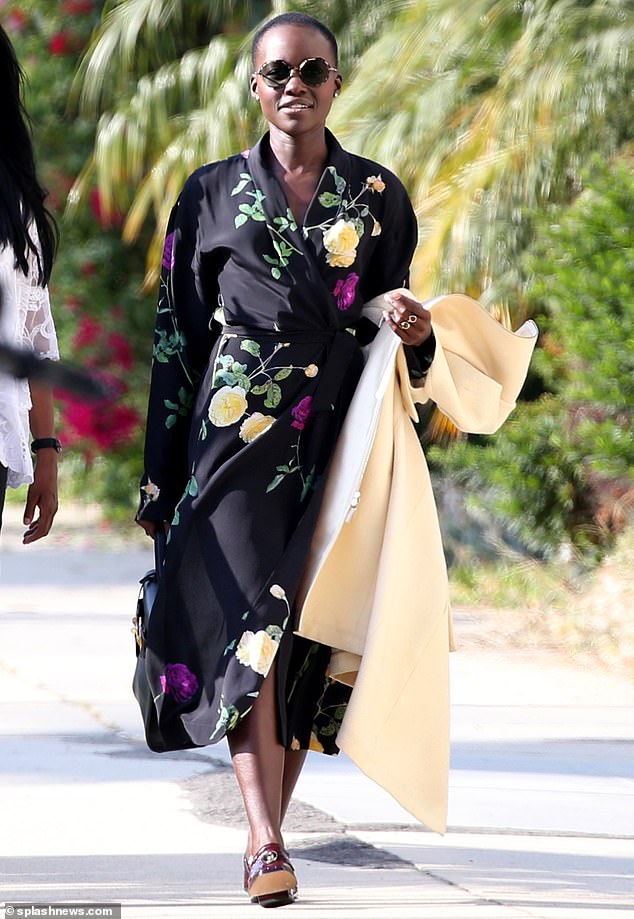 Things are going well: Lupita Nyong'o couldn't wipe the dirt off her face on Monday as she enjoyed a day out with her mother and a friend in California following her emotional breakup with boyfriend Selema Masekala