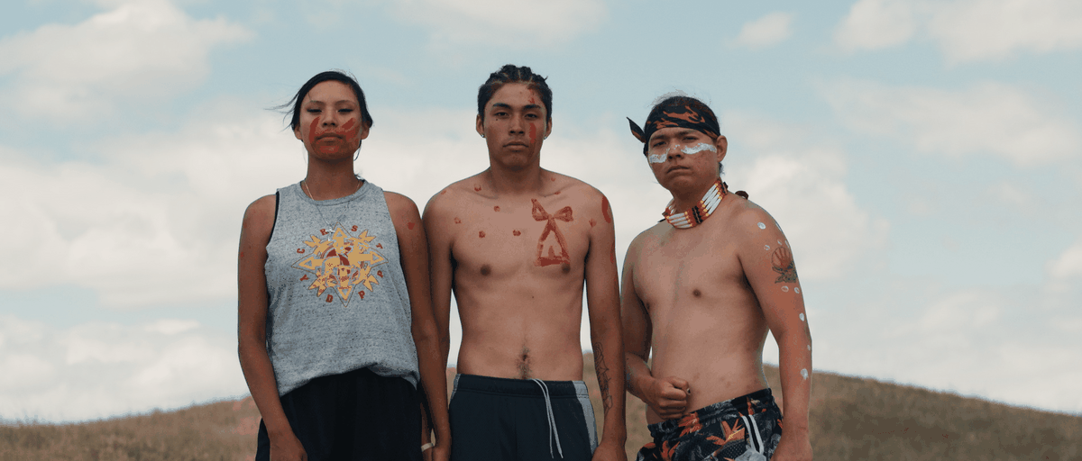 Three protesters with face and body paint in the Lakota Nation vs.