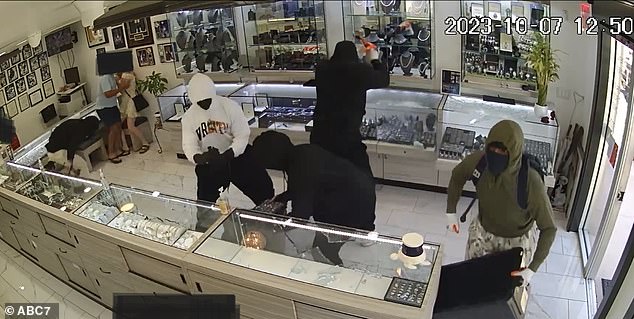 Five hit-and-run thieves smashed jewelry displays with hammers at Prestige Jewelers in Manhattan Beach, California on Friday