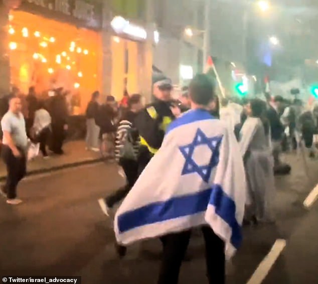 Moment lone Jewish man bravely confronts Pro Palestinian supporters at anti Israel