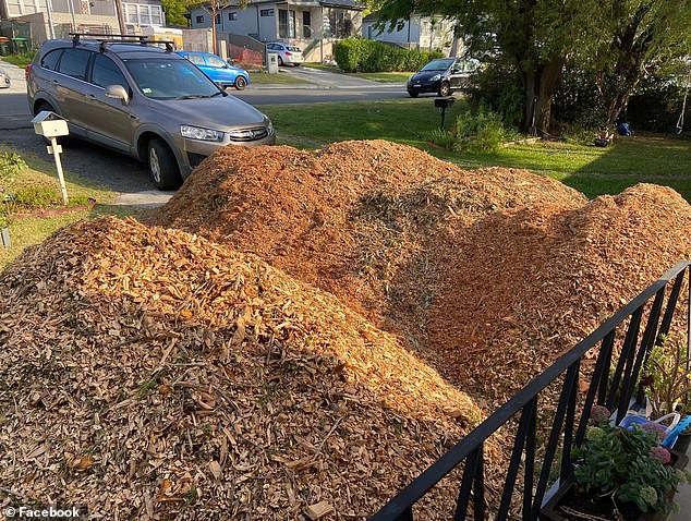 A woman came home to a nasty shock when she realized her husband had accidentally accepted several piles of mulch from a lopper, leaving her home 'barely visible'.