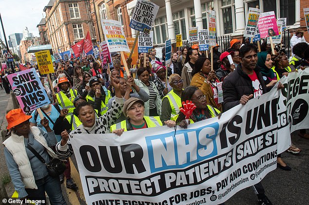 NHS bosses have called for an extra billion pounds to avert a 'profound financial crisis' this autumn after a wave of damaging strikes (Pictured: BMA and UNIT unions marching last week)