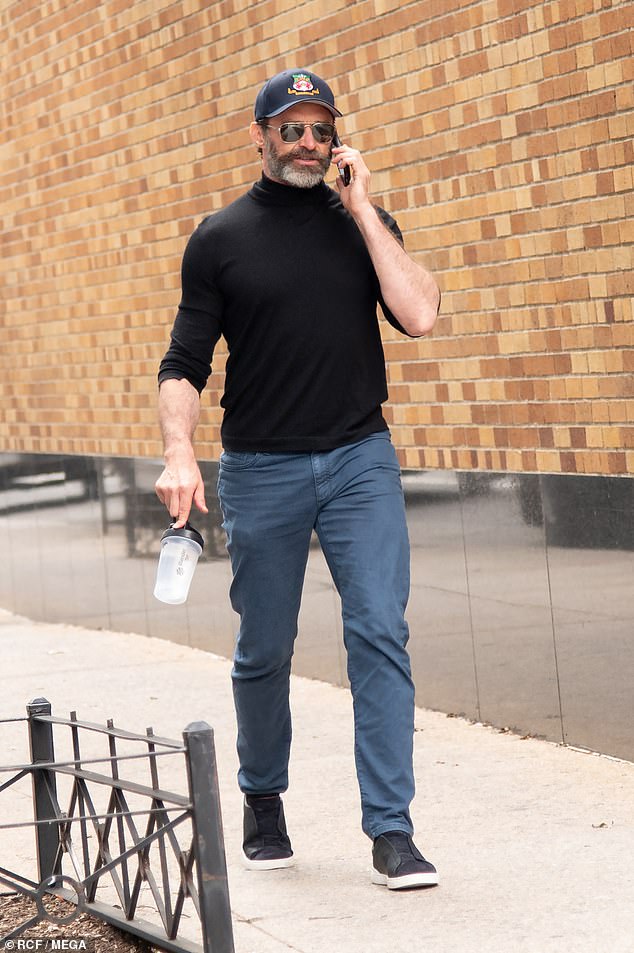 Newly single Hugh Jackman cut a subdued figure as he chatted on the phone during a stroll through New York City on Tuesday, days before his 55th birthday.  On the picture