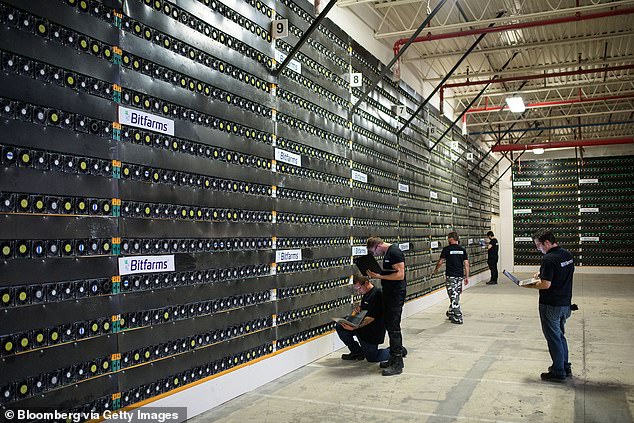 A new UN report finds that cryptocurrency mining has extremely high costs in the form of astronomical amounts of water and land.  Pictured are cryptocurrency mining rigs in Canada