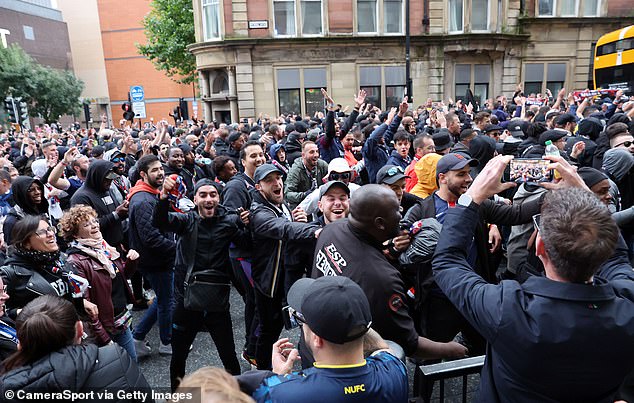 PSG fans pictured as they marched through Newcastle on their way to St James' Park