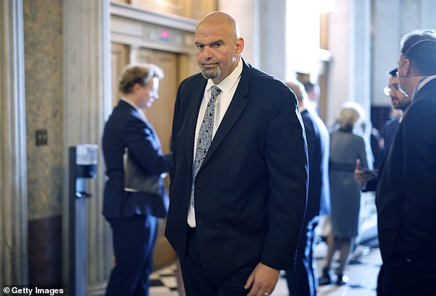 Fetterman offered to 'save democracy' on Wednesday as he vowed to wear a suit on the Senate floor next week, but only if House Republicans 'stop shutting down our government'