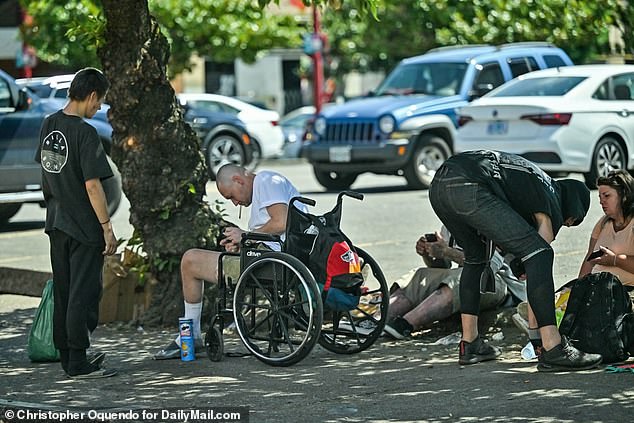 A group of drug users on NW Davis St in downtown Portland.  The city has seen a spike in fentanyl overdose deaths since hard drug use was decriminalized in 2020