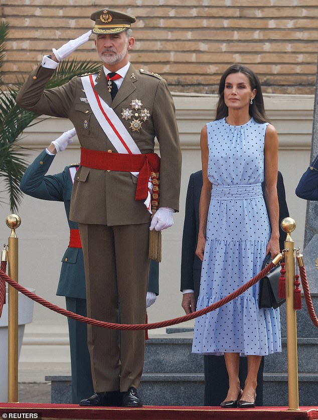 Queen Letizia and King Felipe of Spain looked hand in hand with the proud parents as they watched Princess Leonor attend her flag ceremony today.