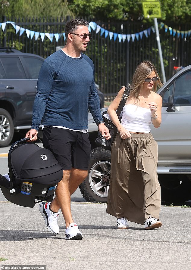 NRL star Sam Burgess stepped out with fiancee Lucy Gray and their newborn Robbie on Thursday.  Everything in the picture