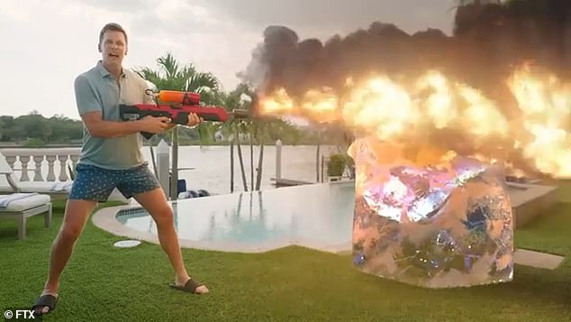 Tom Brady posed with a flamethrower for a commercial promoting the FTX crypto exchange