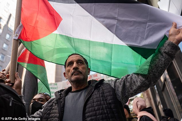 Pro-Palestinian activists are seen by the Israeli consulate on Monday