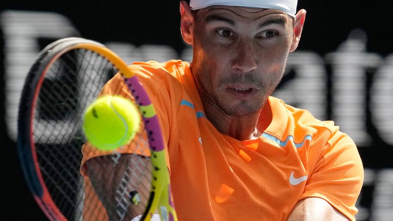 Spain's Rafael Nadal plays a backhand against Britain's Jack Draper during their first round match at the Australian Open tennis tournament in Melbourne, Australia, Monday, Jan. 16, 2023. (AP Photo/Aaron Favila)