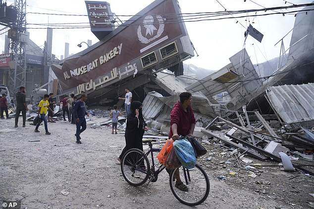 Even before the October 7 Hamas attack, Australian petrol prices had risen 14 percent in a year as inflation worsened again (pictured is rubble in the Gaza Strip near a refugee camp)