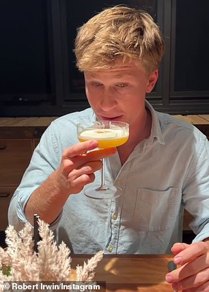 Robert Irwin sipped a cocktail with girlfriend Rorie Buckey, both 19, during an intimate fine dining date night for the couple at Warrior restaurant at Australia Zoo.  In the photo: Robert