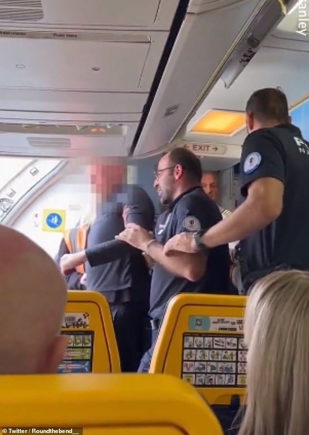 Two officers helped the man down the stairs and off the plane after he fled to Bordeaux